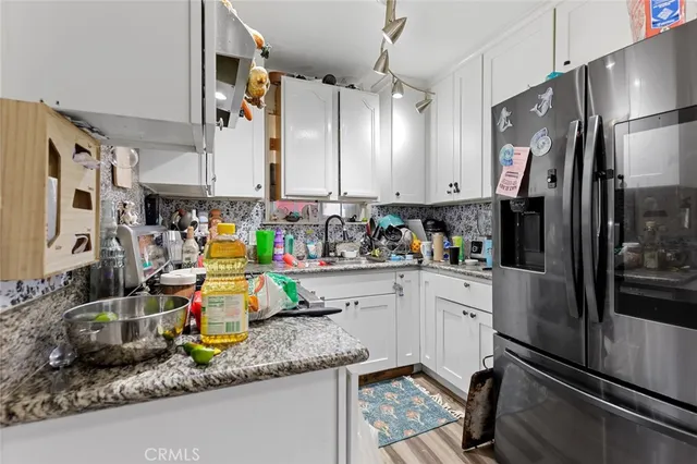 a bathroom with a sink mirror and toilet