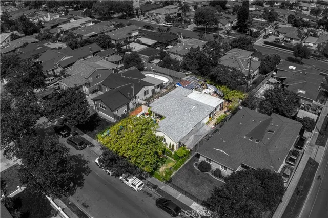 an aerial view of a residential houses with outdoor space