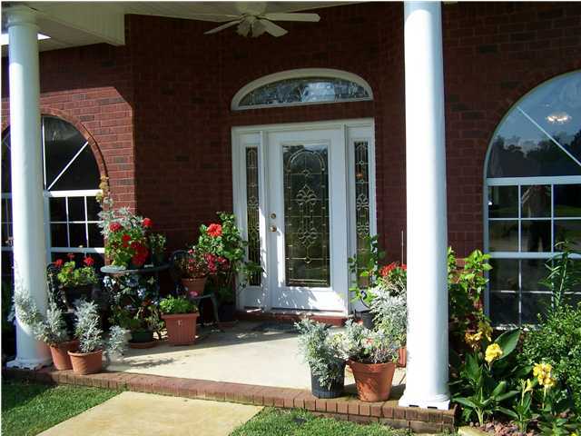 2549 Crescent Road Navarre, FL 32566 - Photo 3 of 22 a view of a house with potted plants