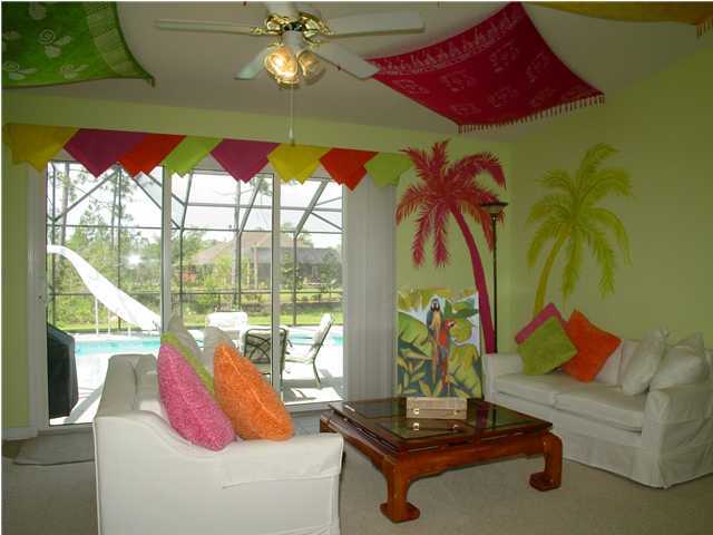 2549 Crescent Road Navarre, FL 32566 - Photo 22 of 22 a living room with furniture and a floor to ceiling window