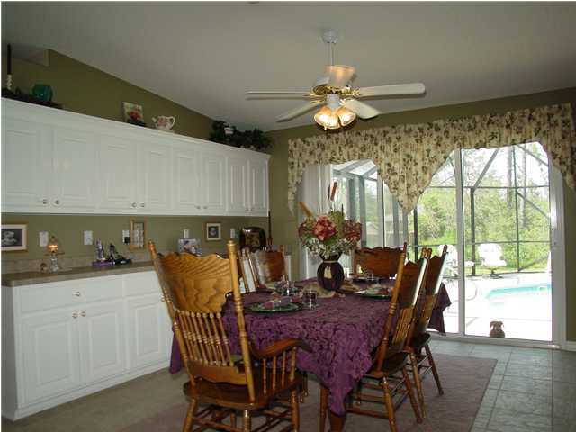 2549 Crescent Road Navarre, FL 32566 - Photo 10 of 22 a view of a dining room with furniture window and outside view