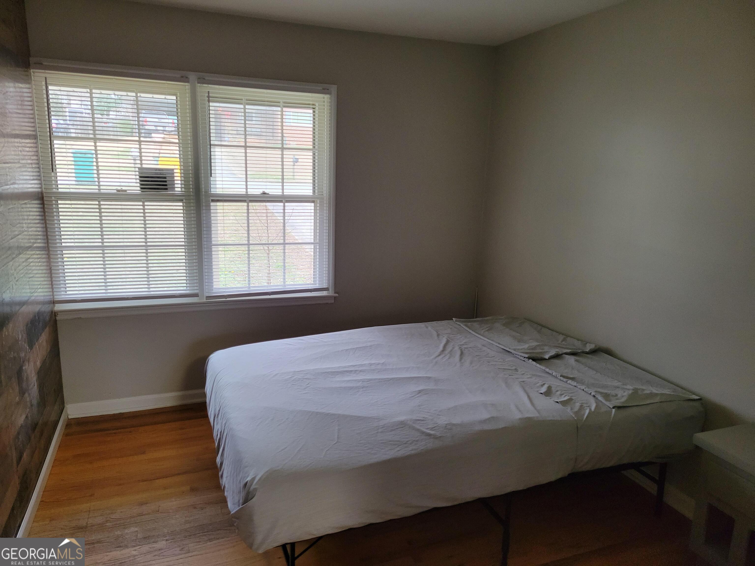 6057 Pinecreek Road Forest Park, GA 30297 - Photo 13 of 15 a bedroom with a bed and a window