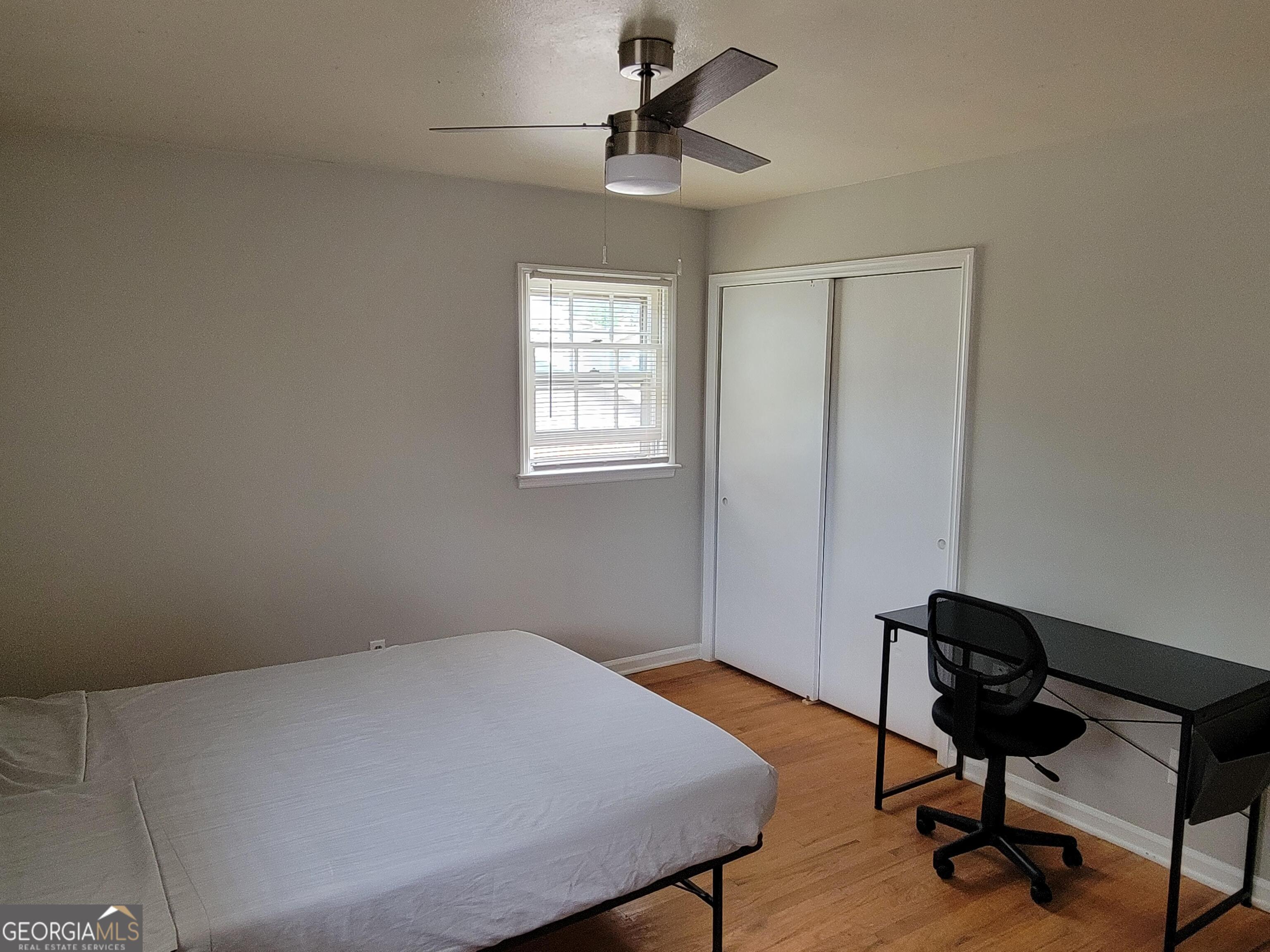 6057 Pinecreek Road Forest Park, GA 30297 - Photo 9 of 15 a bedroom with furniture and a window