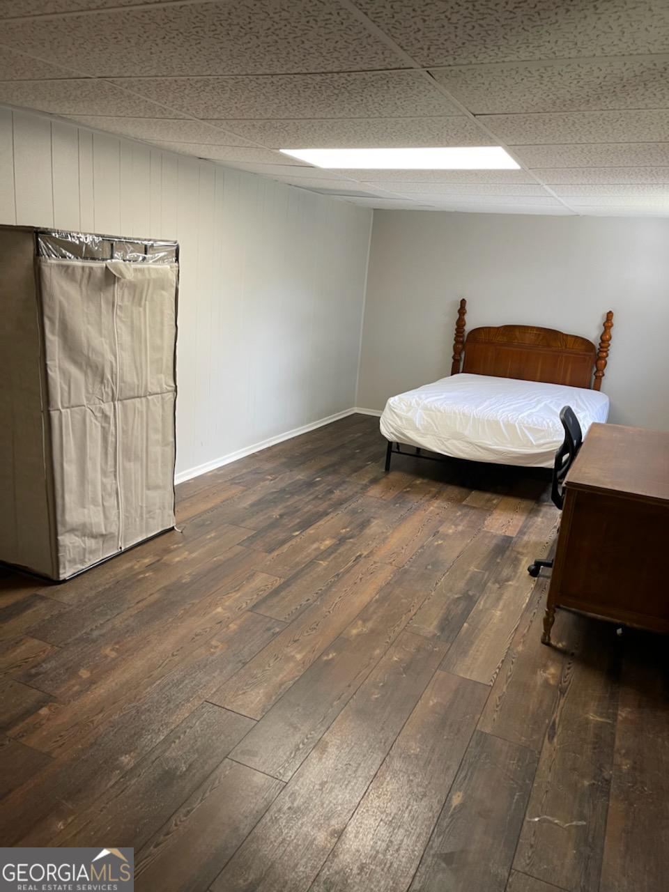 6057 Pinecreek Road Forest Park, GA 30297 - Photo 10 of 15 a view of a room with wooden floor and chair