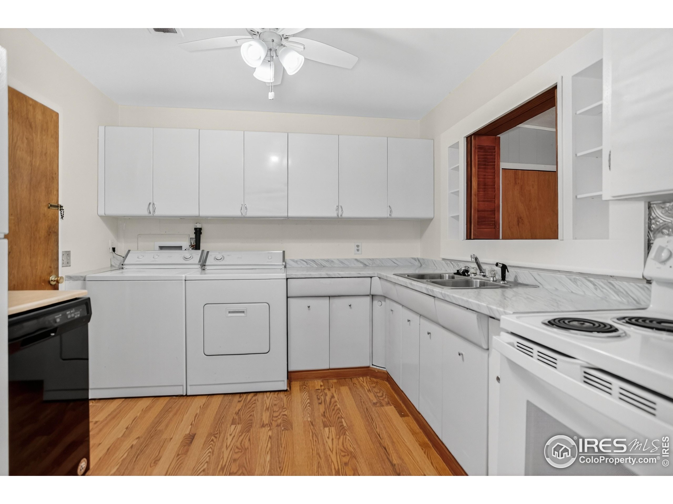 340 29th Street Boulder, CO 80305 - Photo 11 of 39 a kitchen with a sink cabinets and window