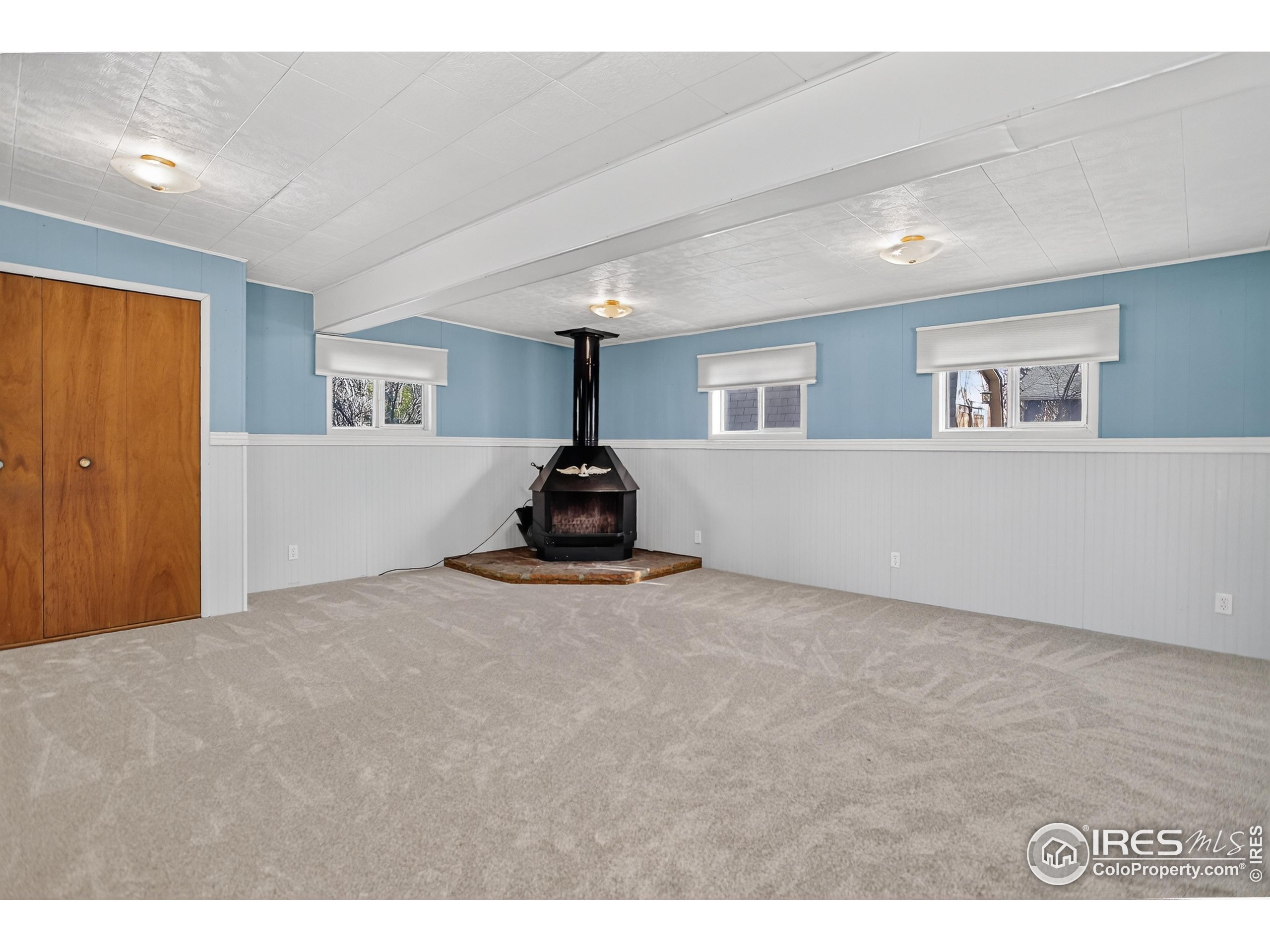 340 29th Street Boulder, CO 80305 - Photo 17 of 39 a view of empty room with window and a fireplace