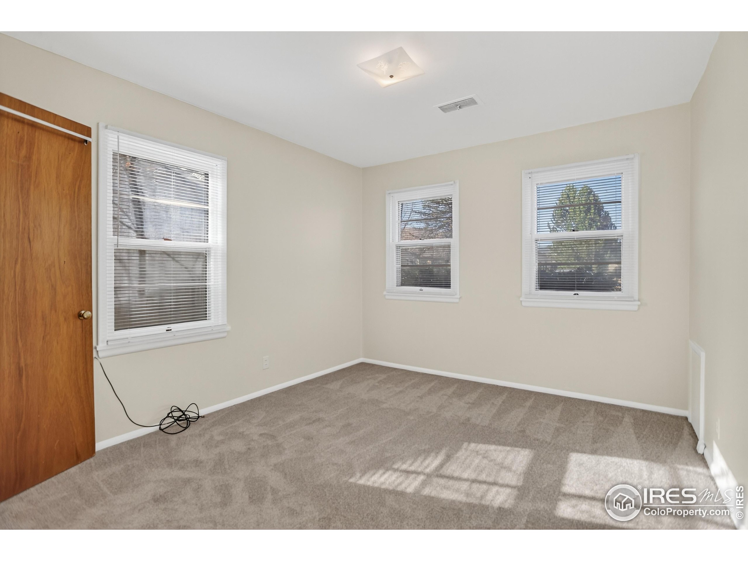 340 29th Street Boulder, CO 80305 - Photo 21 of 39 a view of an empty room with a window