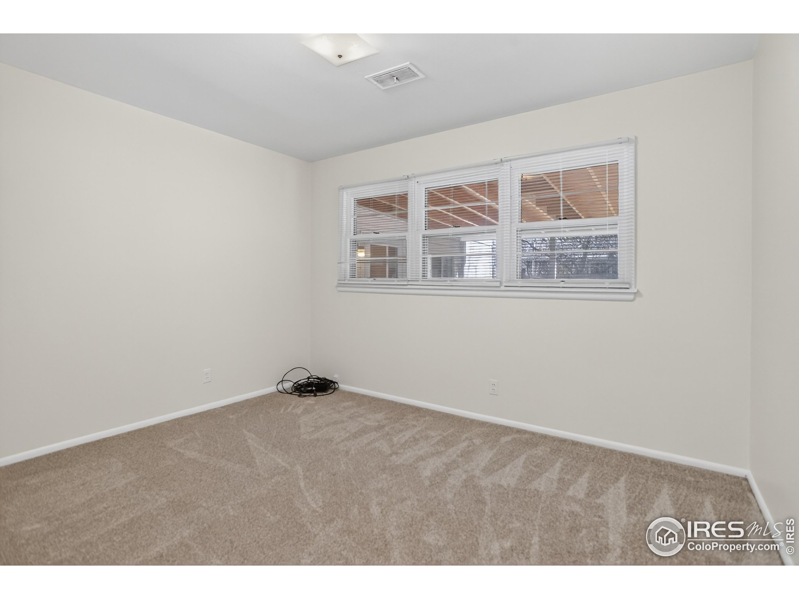 340 29th Street Boulder, CO 80305 - Photo 26 of 39 a view of an empty room with a window