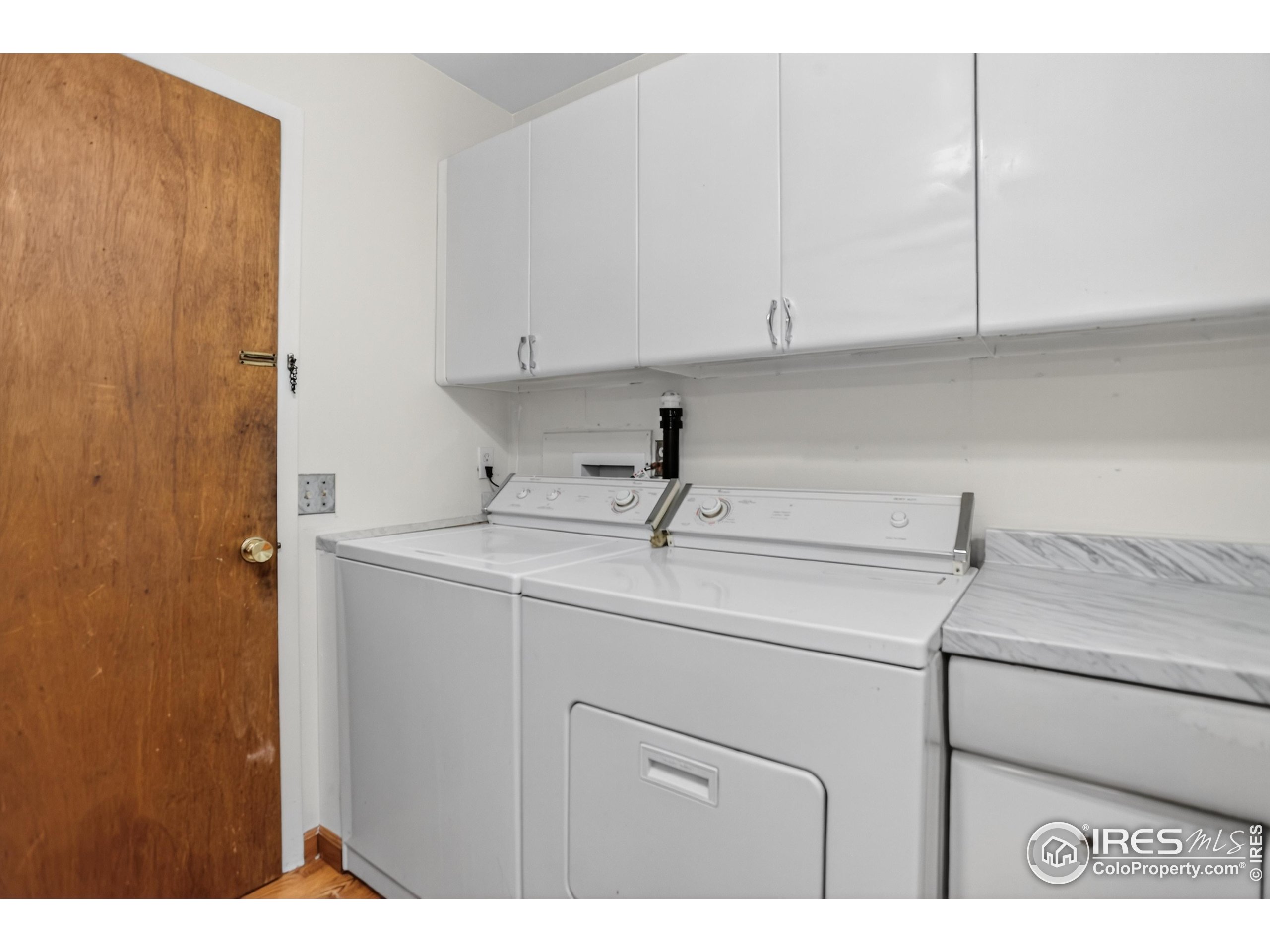 340 29th Street Boulder, CO 80305 - Photo 30 of 39 a kitchen with a sink and cabinets