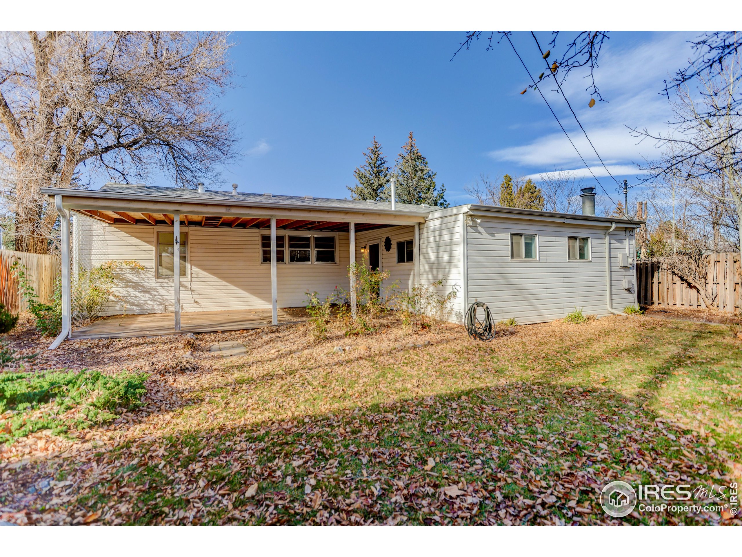 340 29th Street Boulder, CO 80305 - Photo 31 of 39 a view of a house with a yard