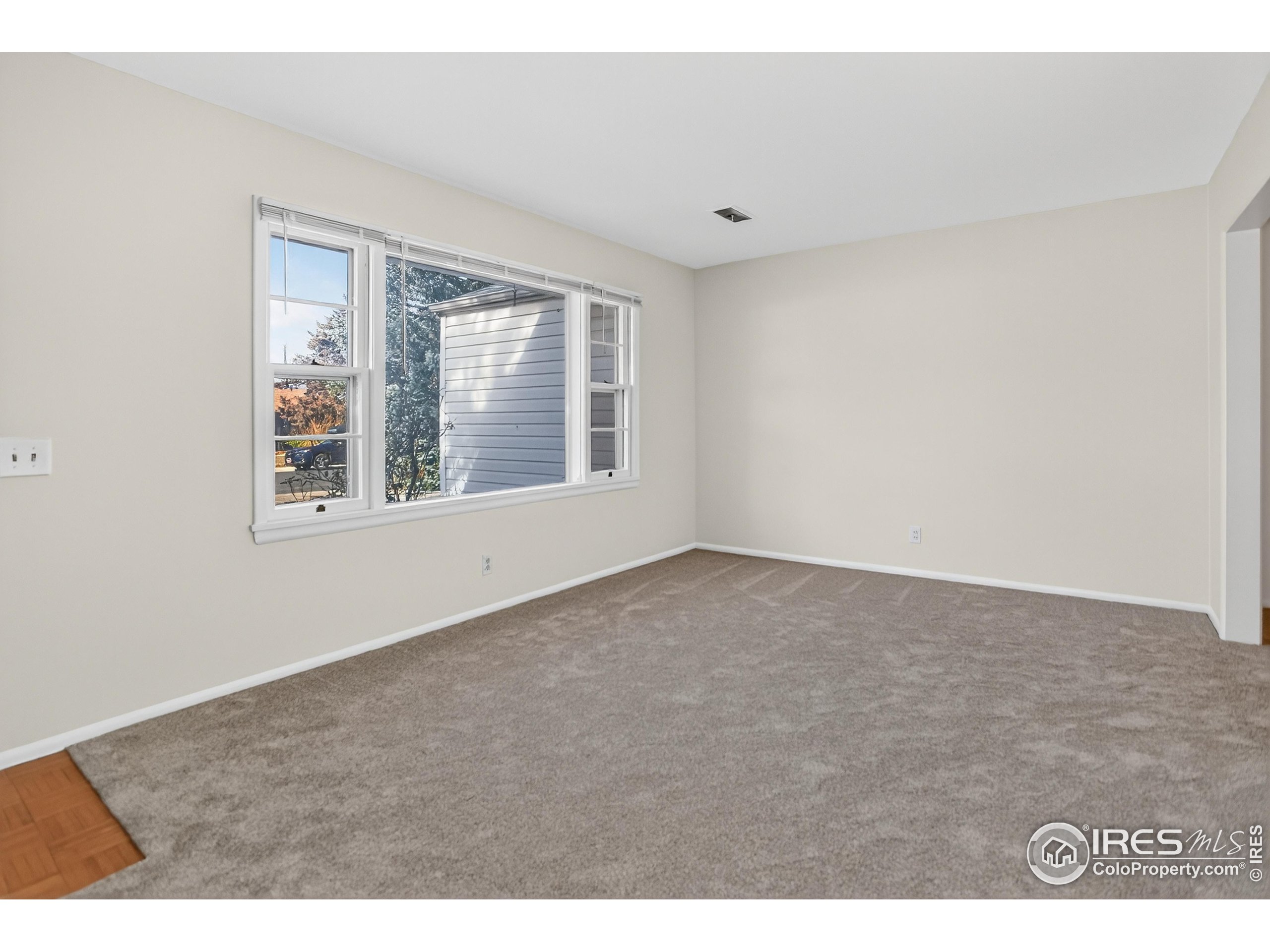 340 29th Street Boulder, CO 80305 - Photo 7 of 39 a view of an empty room with a window