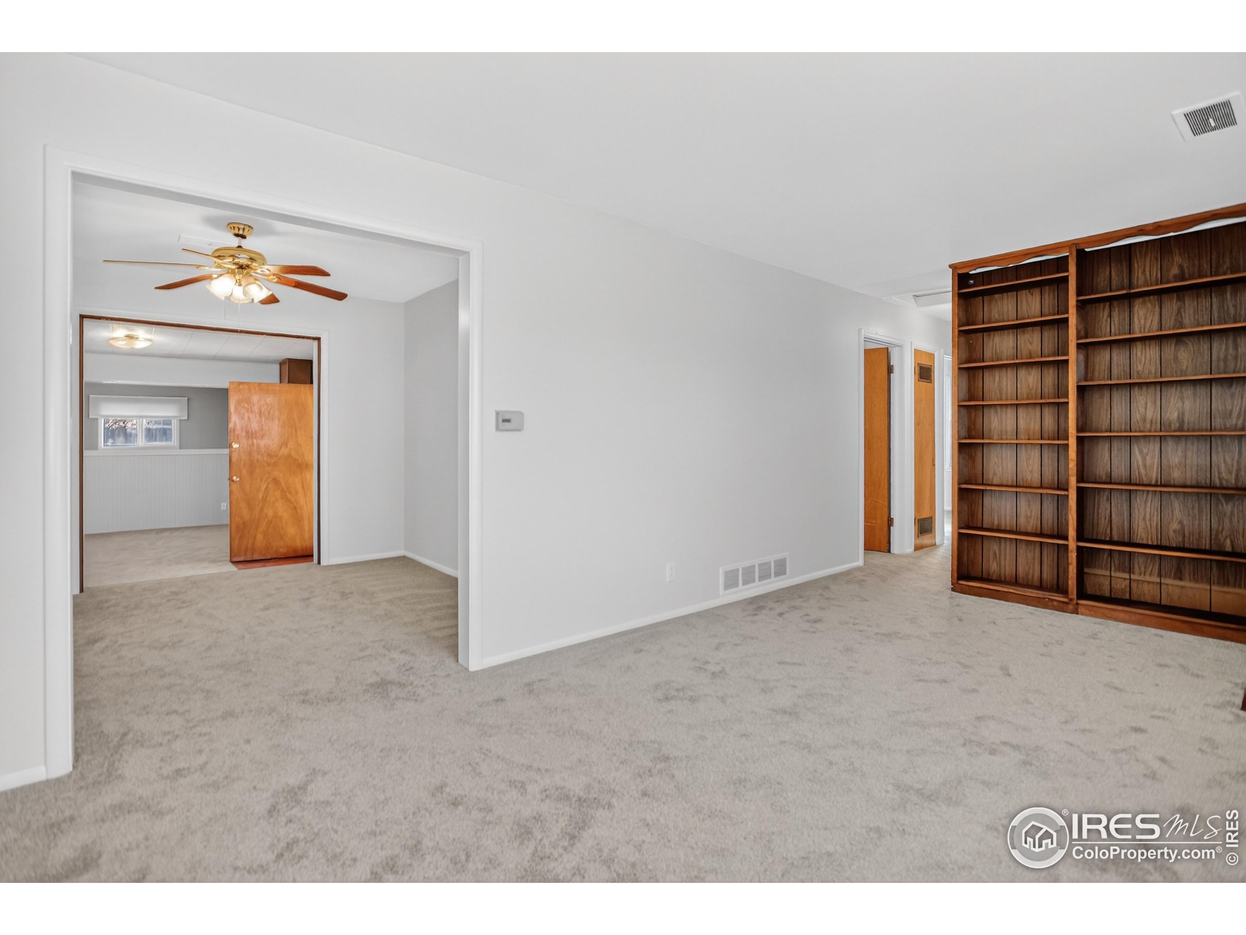 340 29th Street Boulder, CO 80305 - Photo 8 of 39 a view of an empty room with cabinet and wooden floor