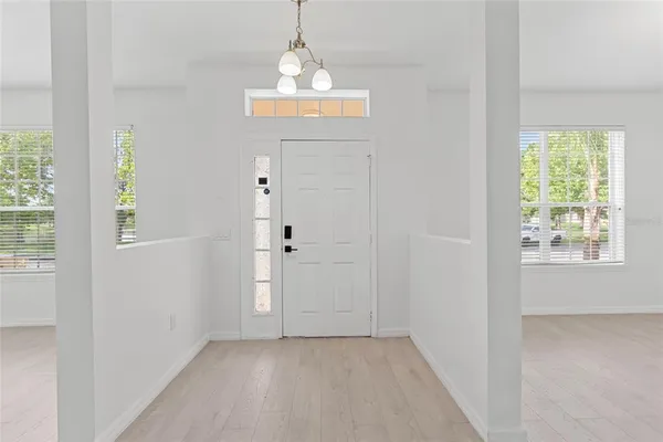 an empty room with a chandelier