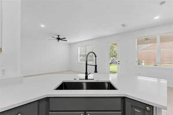 a kitchen with a sink and cabinets