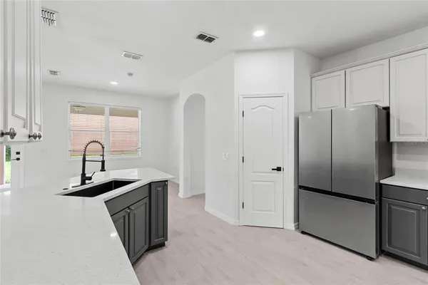 a bathroom with a tub sink shower and mirror
