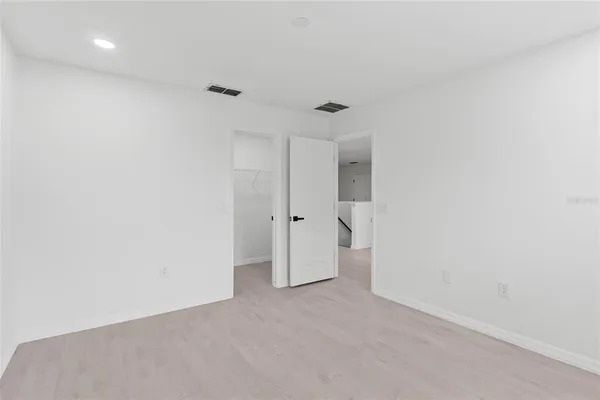 a bathroom with a sink a large mirror and a window