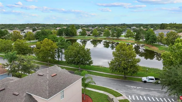 a view of a lake with houses in the back