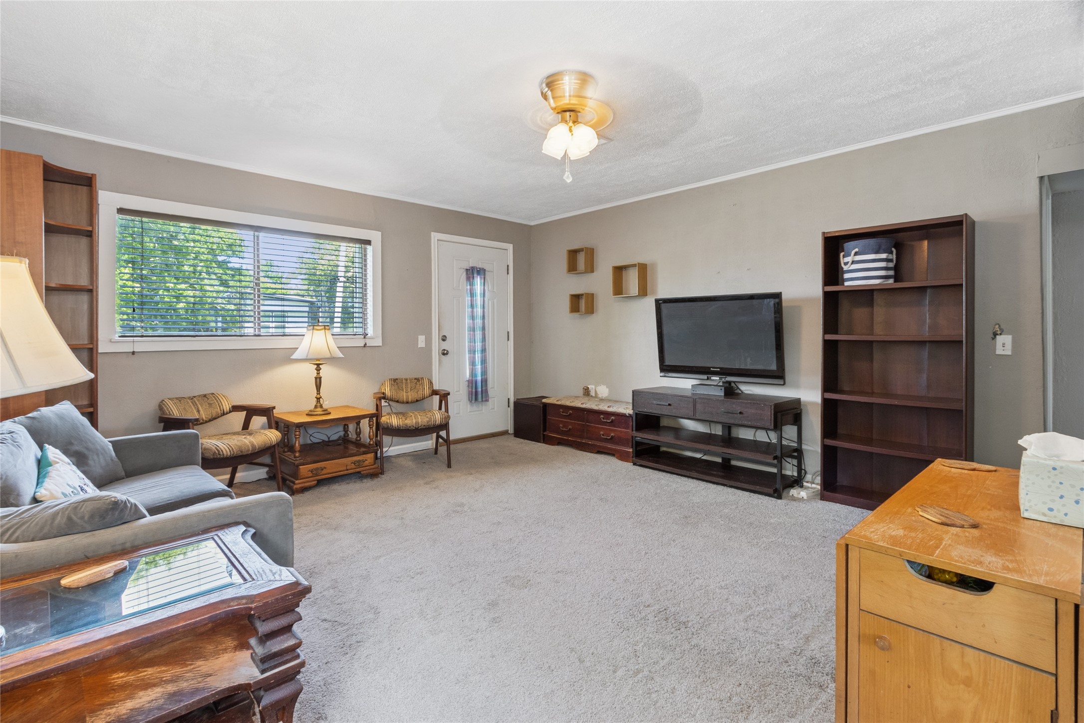 4820 Palmetto Street Bacliff, TX 77518 - Photo 7 of 22 a living room with furniture and a flat screen tv