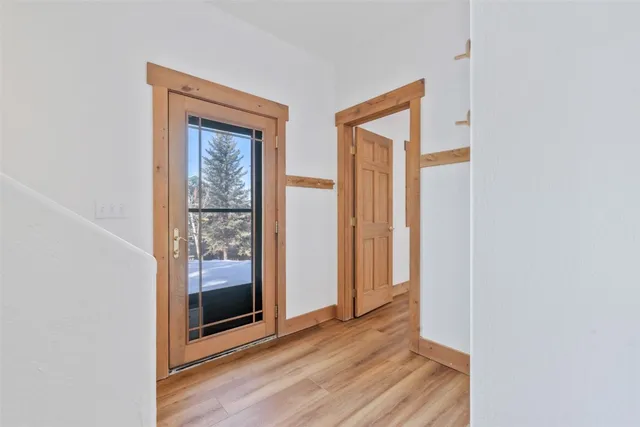 a view of a room with wooden floor