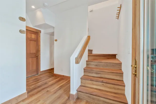 a view of entryway with wooden floor