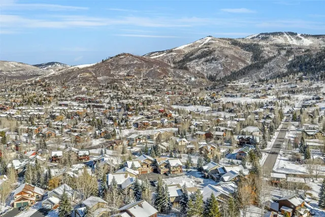 an aerial view of residential building and ocean view