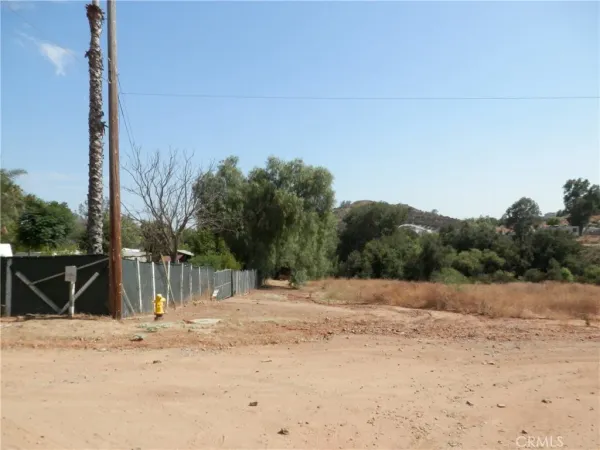 a backyard of a house with large trees