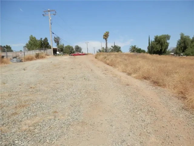 a view of a lush green hillside and a houses