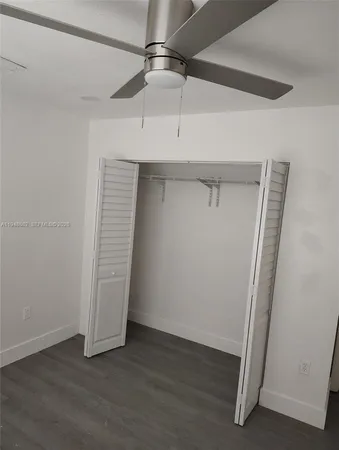 an empty room with wooden floor