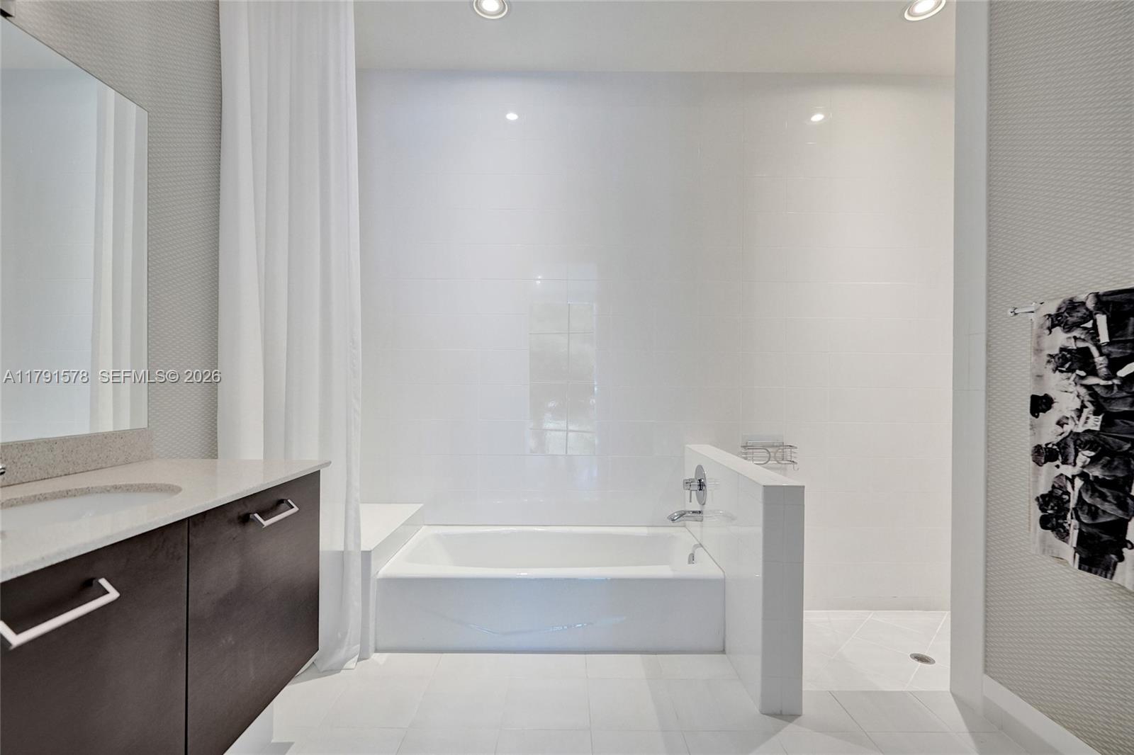 2725 Northeast 1st Street Pompano Beach, FL 33062 - Photo 19 of 59 a bathroom with a bathtub and a sink