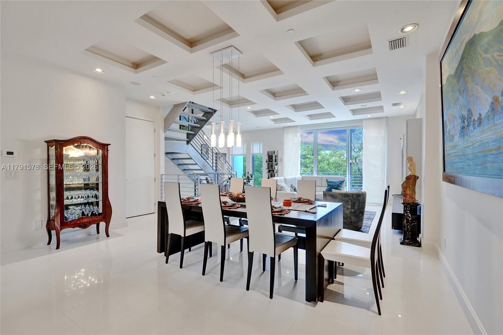 2725 Northeast 1st Street Pompano Beach, FL 33062 - Photo 24 of 59 a dining room with furniture and window