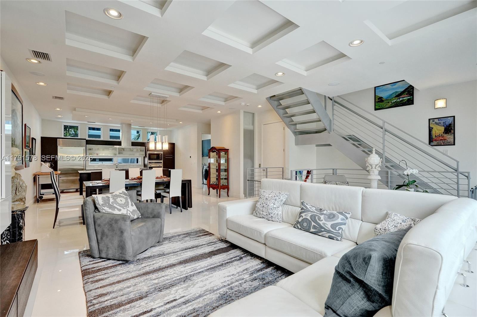 2725 Northeast 1st Street Pompano Beach, FL 33062 - Photo 25 of 59 a living room with furniture and a flat screen tv