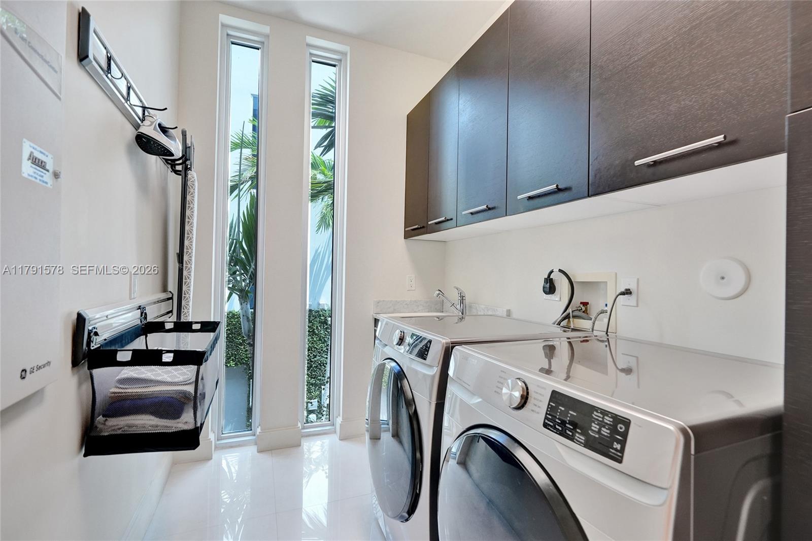 2725 Northeast 1st Street Pompano Beach, FL 33062 - Photo 27 of 59 a utility room with dryer and washer