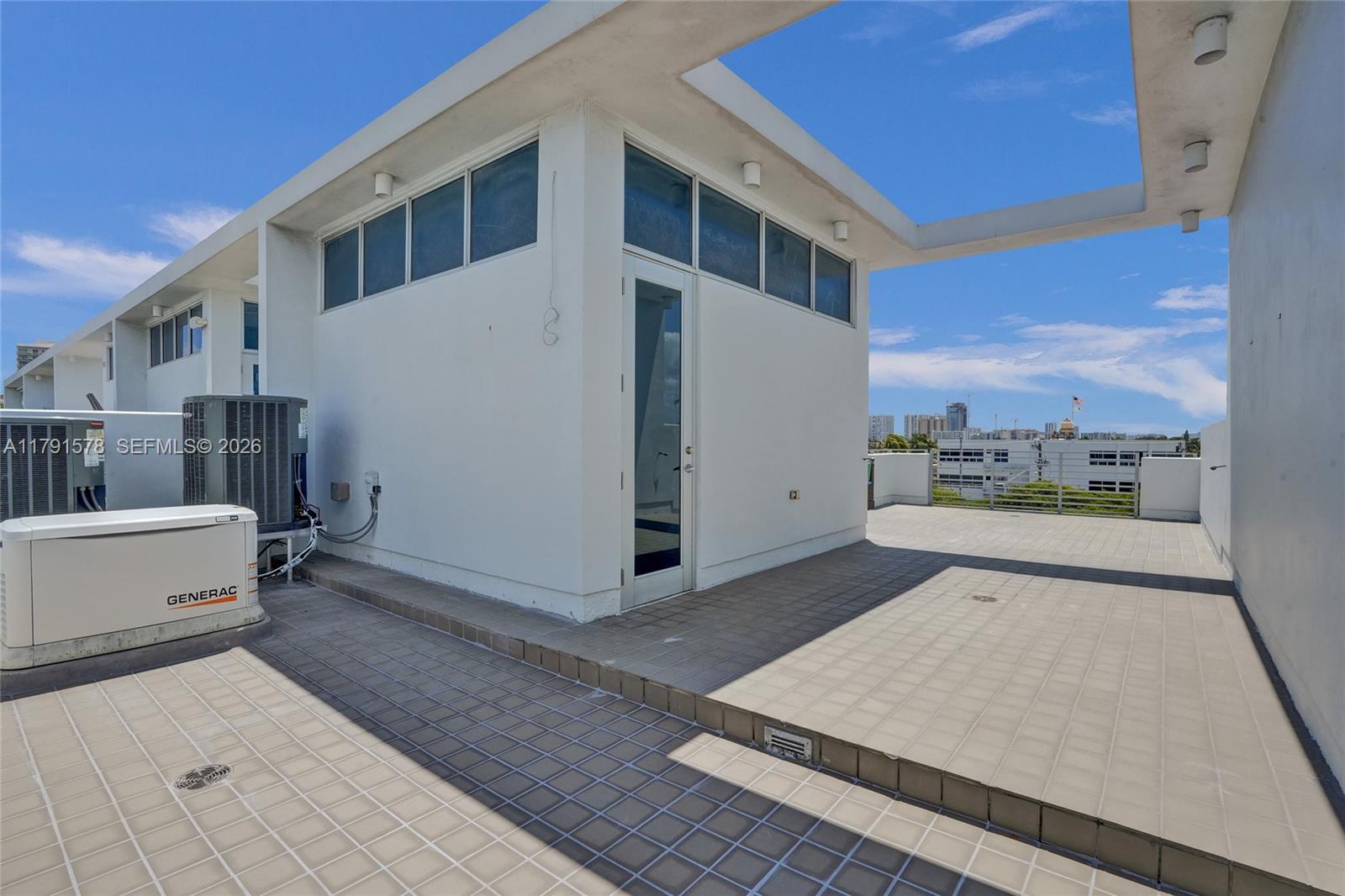 2725 Northeast 1st Street Pompano Beach, FL 33062 - Photo 47 of 59 a view of a terrace with a bench