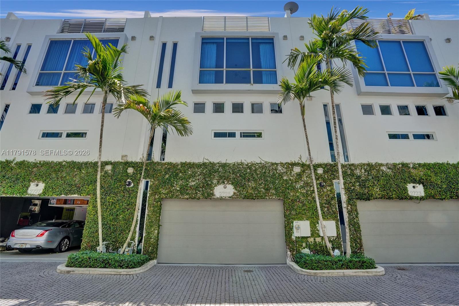 2725 Northeast 1st Street Pompano Beach, FL 33062 - Photo 51 of 59 a front view of a house with a garden