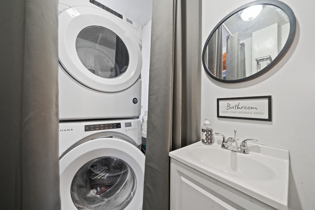 73 Monroe Street Abington, MA 02351 - Photo 13 of 28 a bathroom with a sink and a mirror