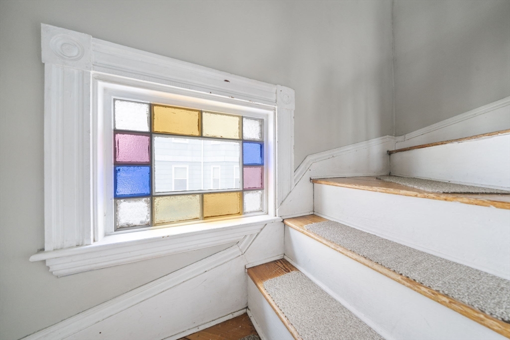 73 Monroe Street Abington, MA 02351 - Photo 15 of 28 a bathroom with a large window and a bathtub