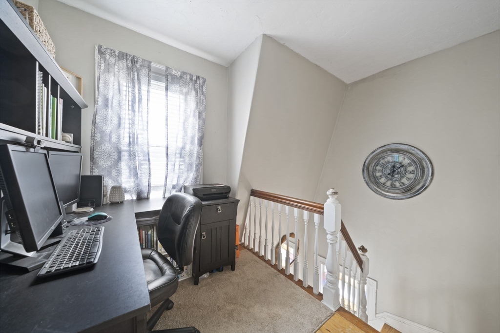 73 Monroe Street Abington, MA 02351 - Photo 16 of 28 a view of a livingroom with workspace and a window