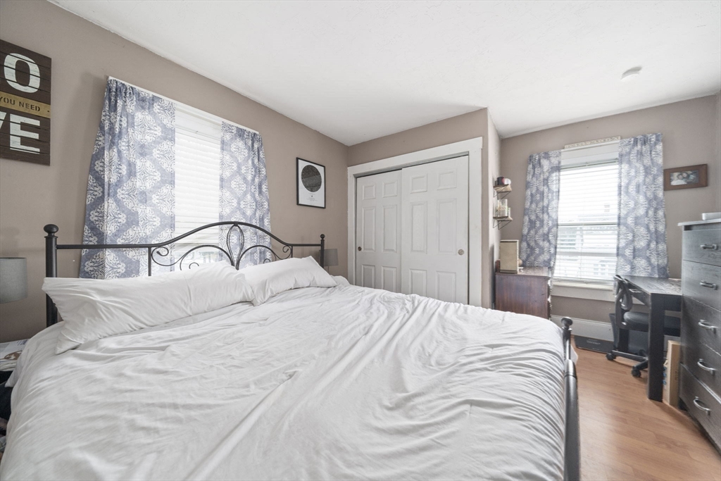 73 Monroe Street Abington, MA 02351 - Photo 20 of 28 a bedroom with a large bed and a window