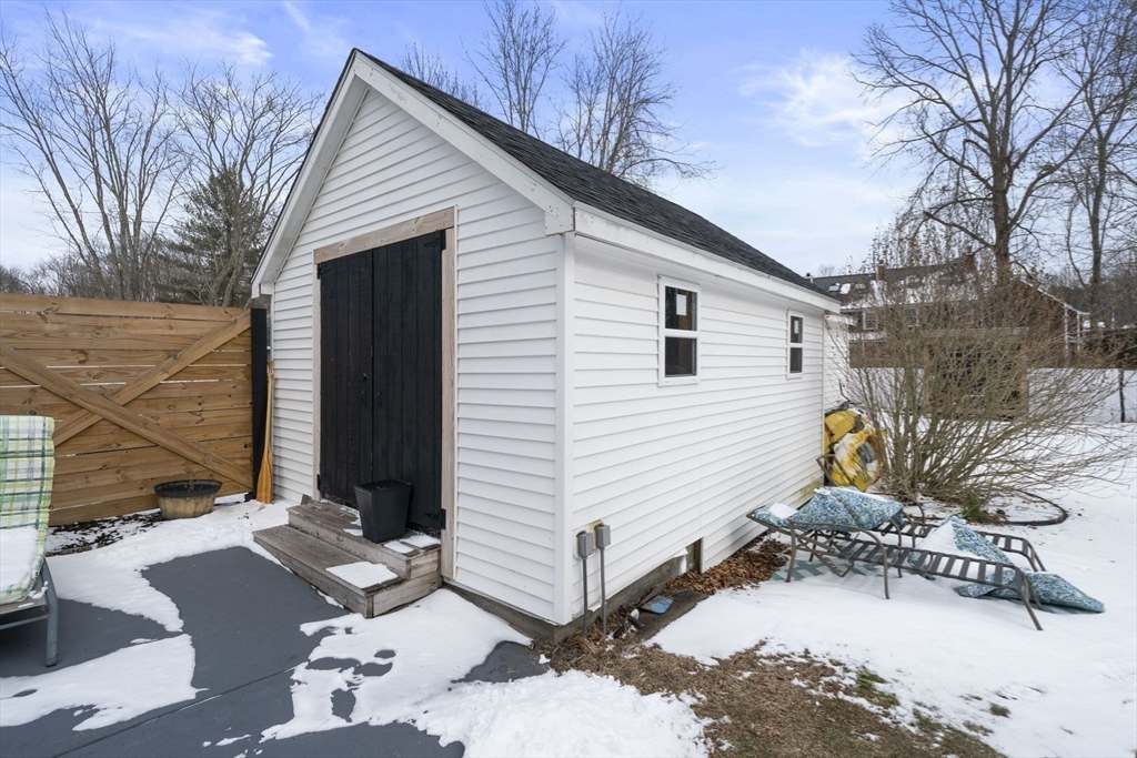 73 Monroe Street Abington, MA 02351 - Photo 28 of 28 a view of a house with snow on the side of the road