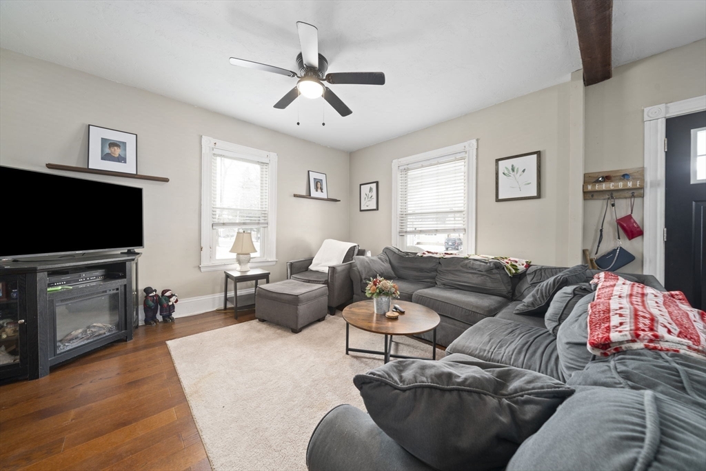 73 Monroe Street Abington, MA 02351 - Photo 4 of 28 a living room with furniture and a flat screen tv