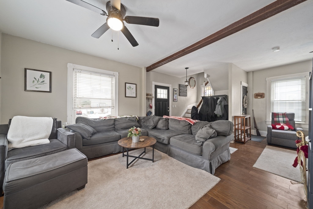 73 Monroe Street Abington, MA 02351 - Photo 5 of 28 a living room with furniture and a large window