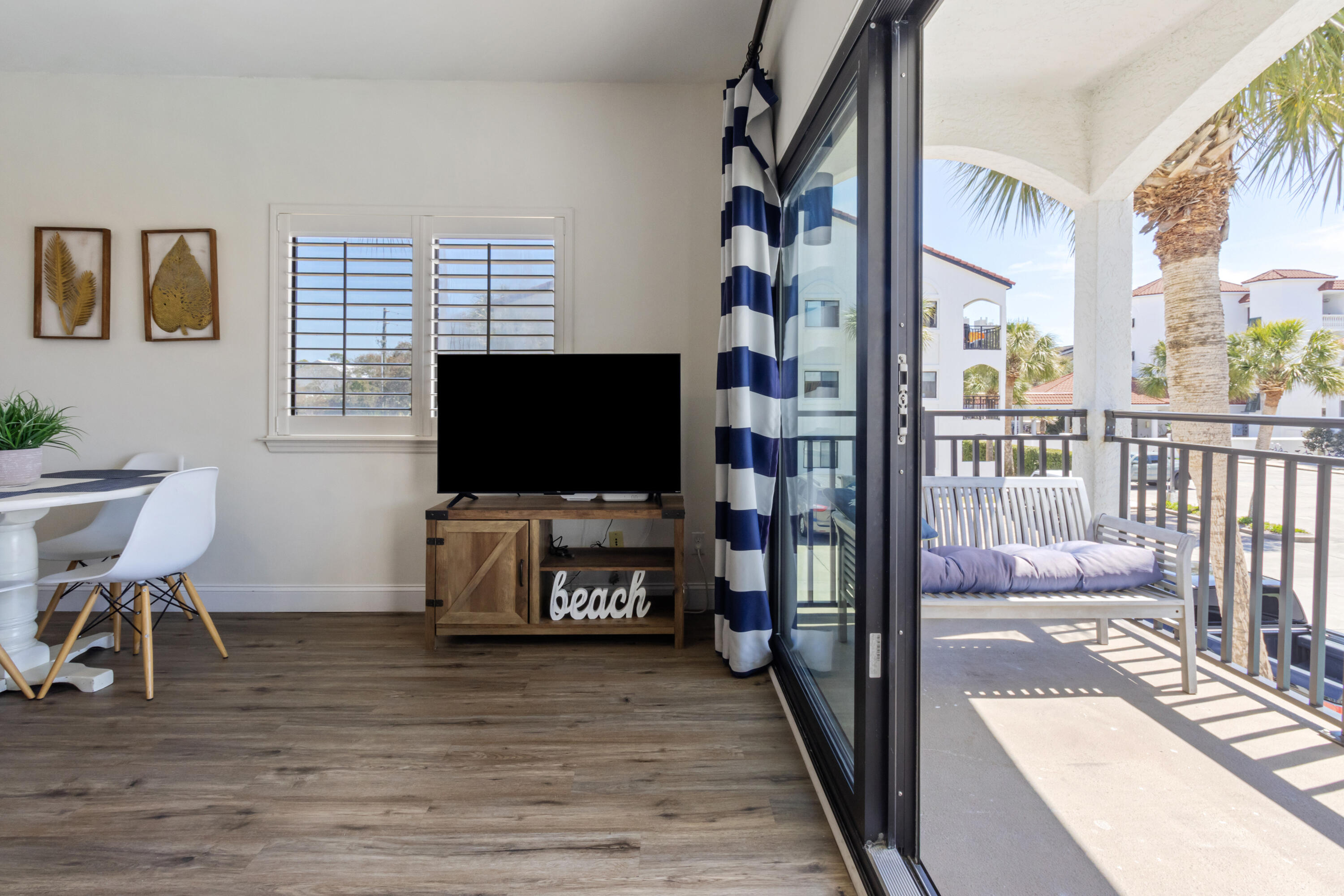 3604 East County Highway 30A, Unit B4 Santa Rosa Beach, FL 32459 - Photo 17 of 39 a living room with furniture and a flat screen tv