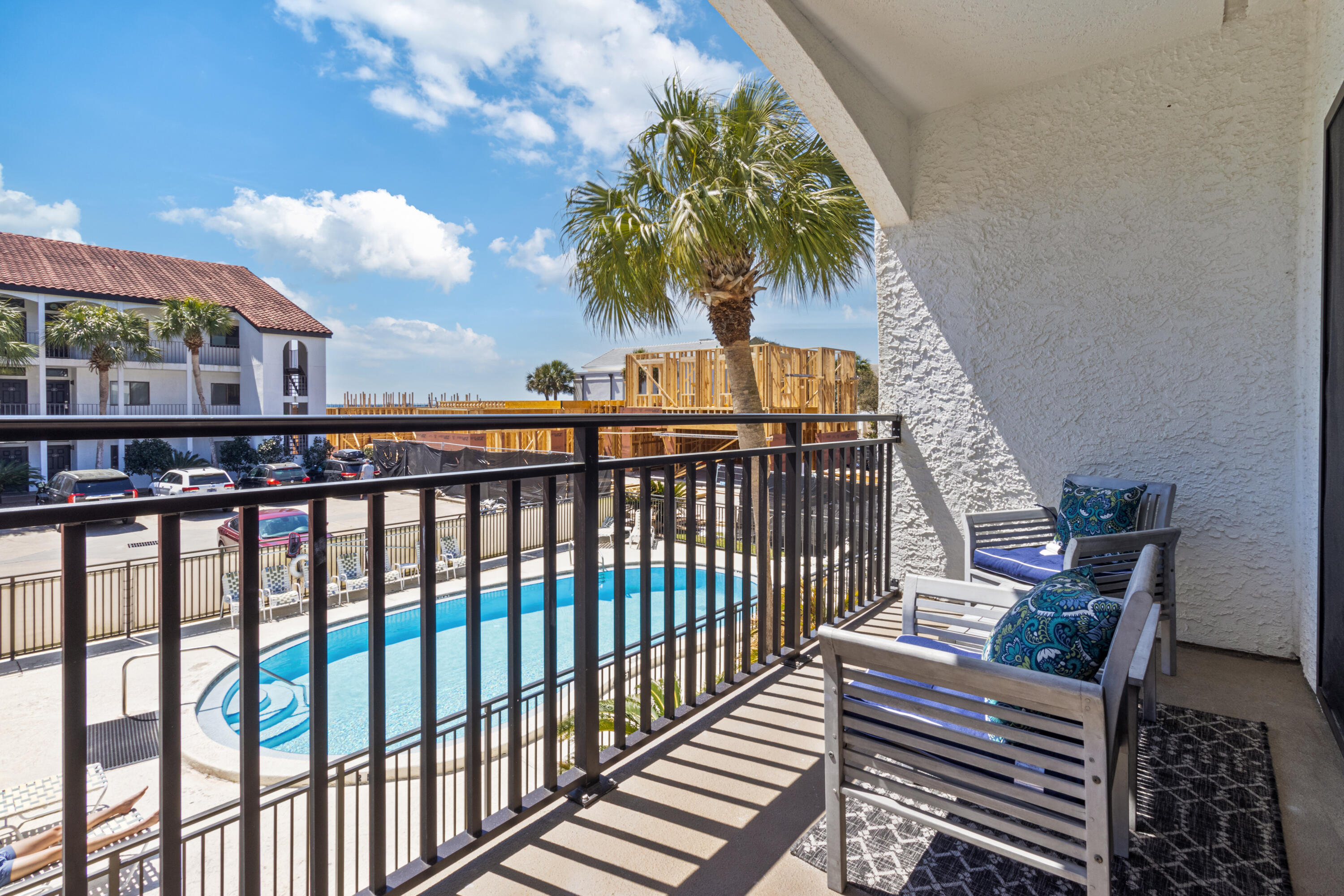 3604 East County Highway 30A, Unit B4 Santa Rosa Beach, FL 32459 - Photo 19 of 39 a view of balcony with wooden floor and outdoor seating
