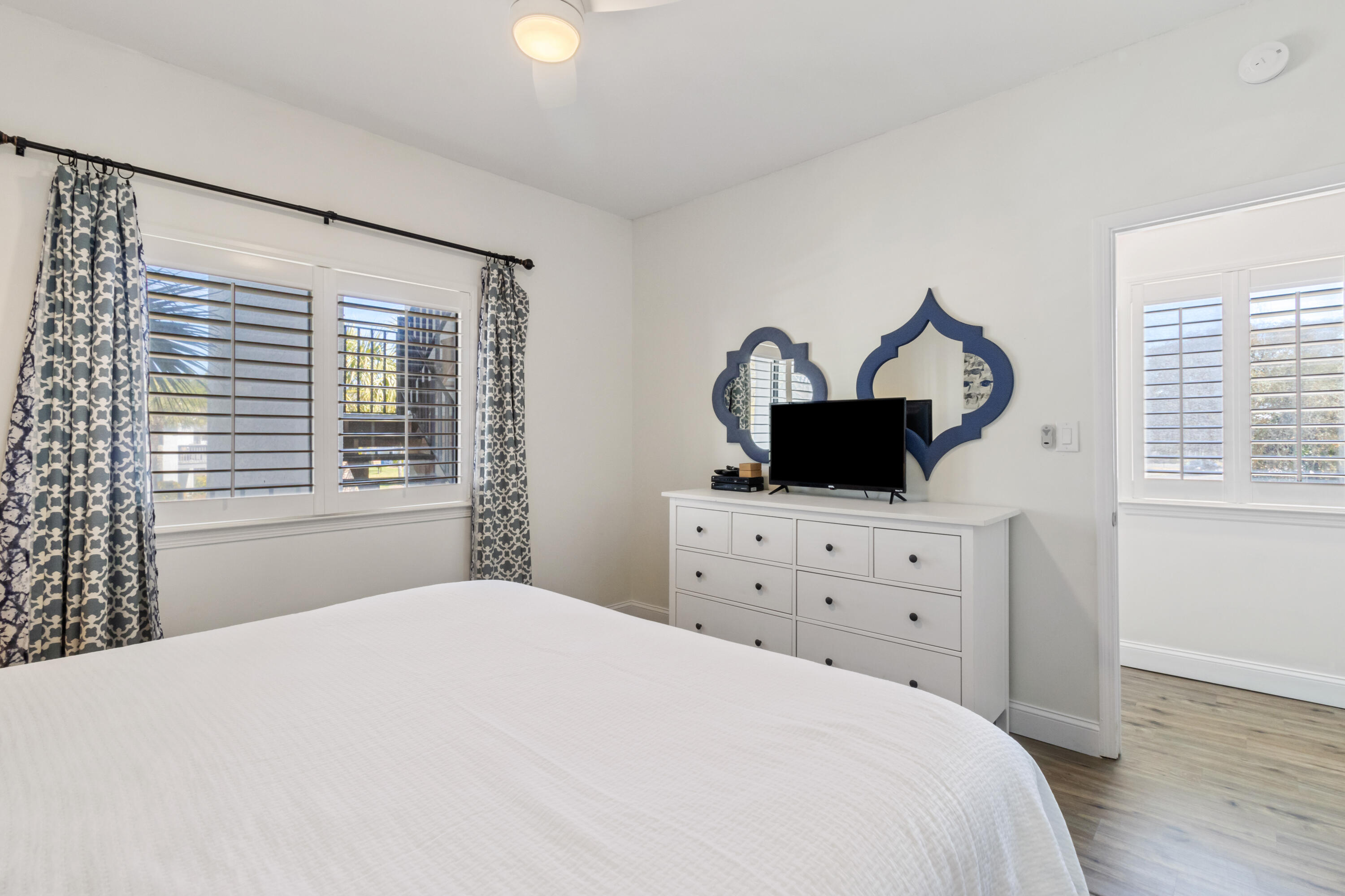 3604 East County Highway 30A, Unit B4 Santa Rosa Beach, FL 32459 - Photo 30 of 39 a bedroom with a bed a window and dresser