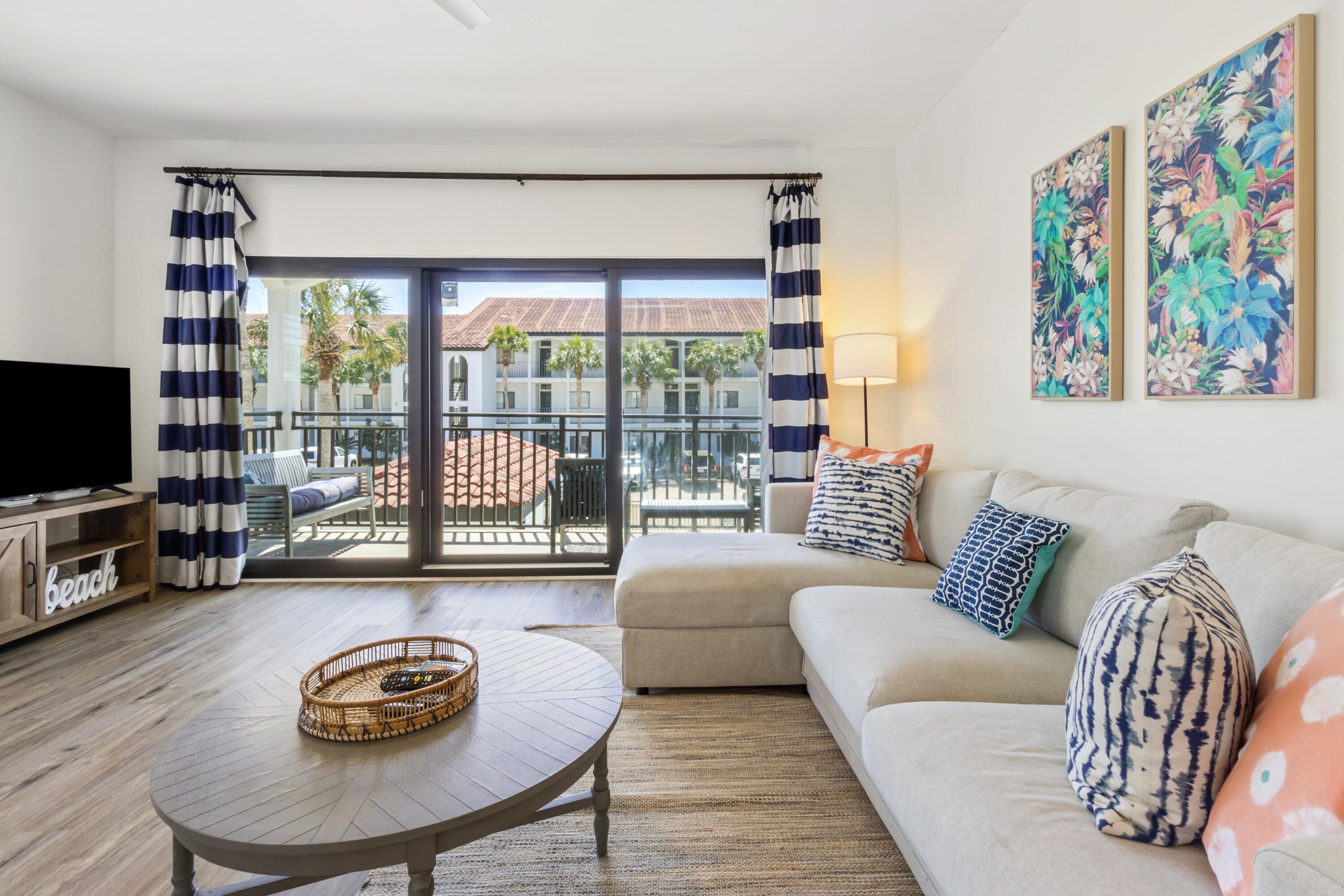 3604 East County Highway 30A, Unit B4 Santa Rosa Beach, FL 32459 - Photo 3 of 39 a living room with furniture and a flat screen tv