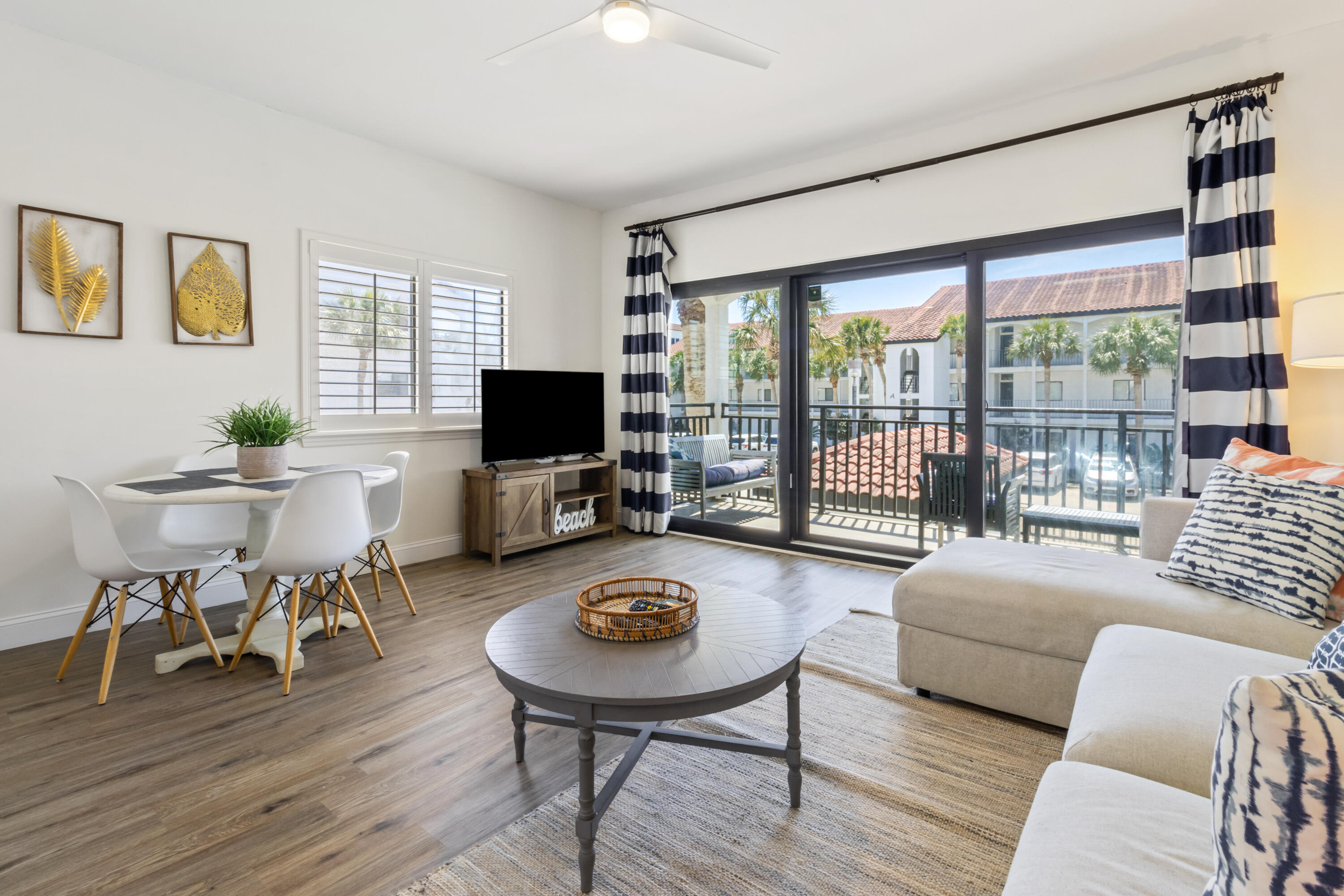 3604 East County Highway 30A, Unit B4 Santa Rosa Beach, FL 32459 - Photo 5 of 39 a living room with furniture and a flat screen tv