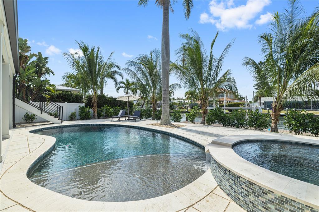 405 28th Street Holmes Beach, FL 34217 - Photo 13 of 50 a view of a swimming pool with a sitting space