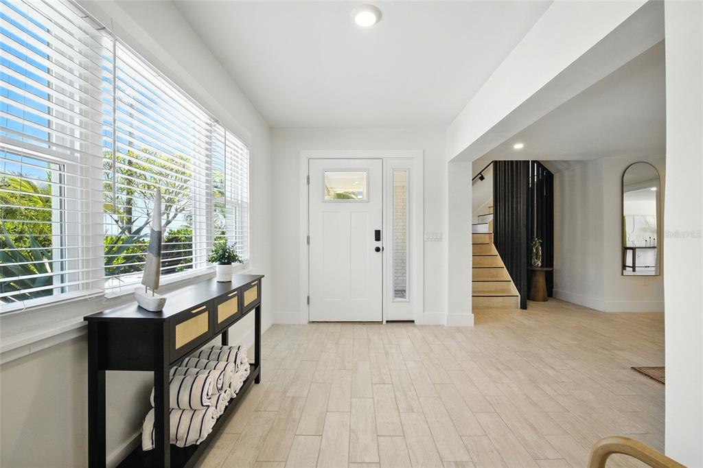 405 28th Street Holmes Beach, FL 34217 - Photo 22 of 50 a view of a room with stairs and a large window