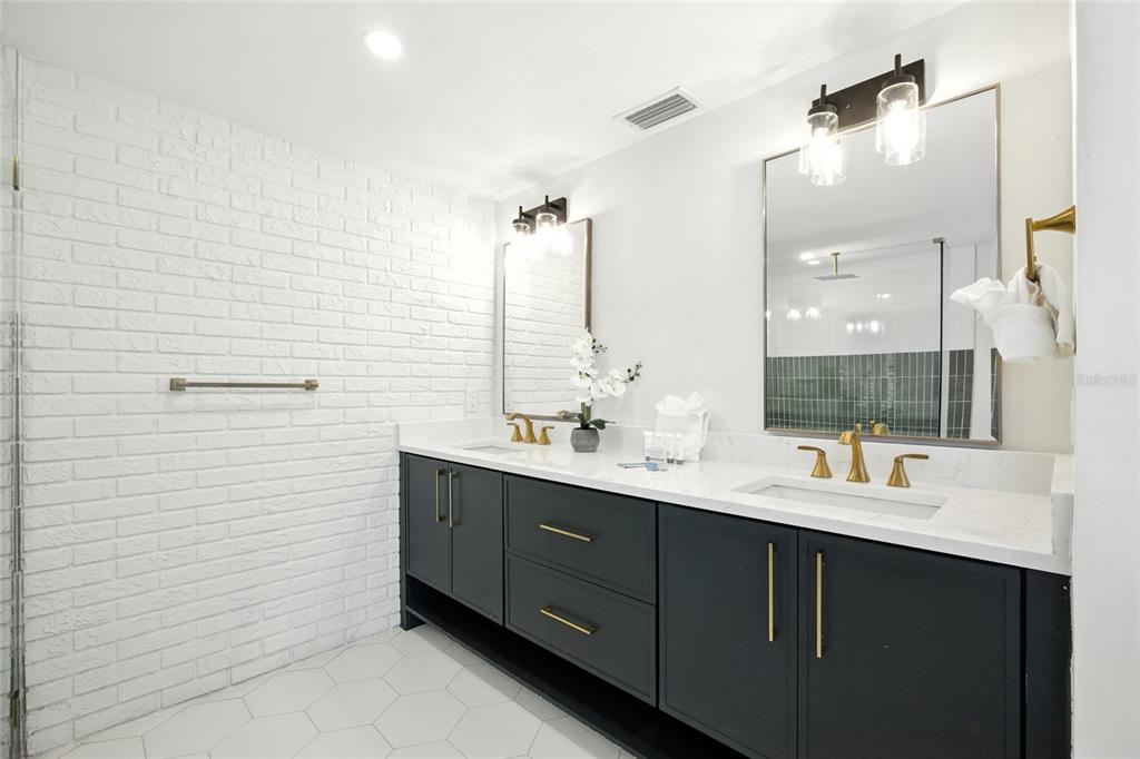 405 28th Street Holmes Beach, FL 34217 - Photo 26 of 50 a bathroom with a double vanity sink and mirror