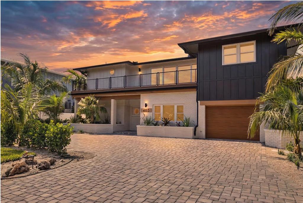 405 28th Street Holmes Beach, FL 34217 - Photo 49 of 50 a view of a house with a yard